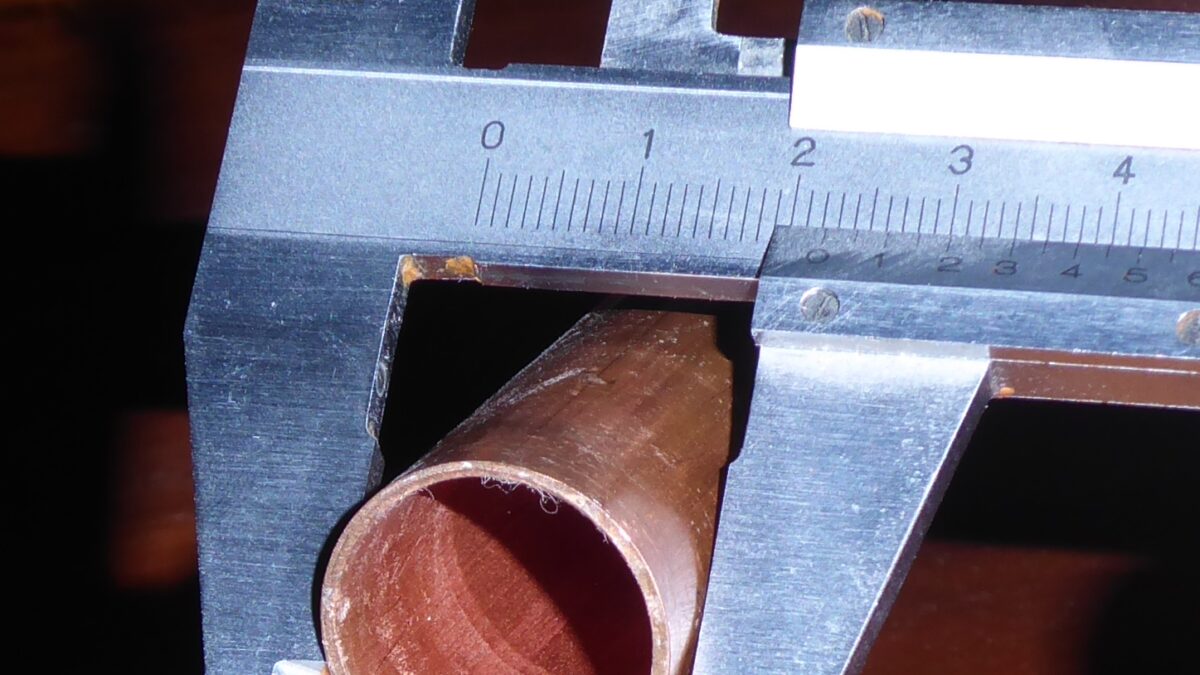 Caliper measuring the outside diameter of a copper tube