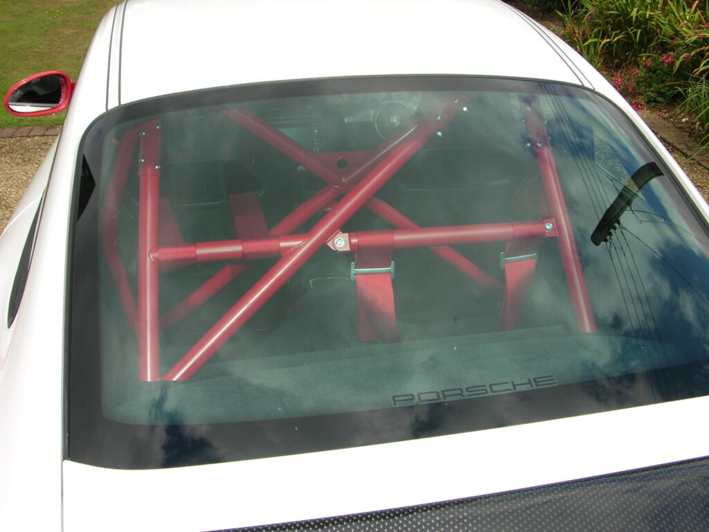 Red roll cage installed inside a sports car