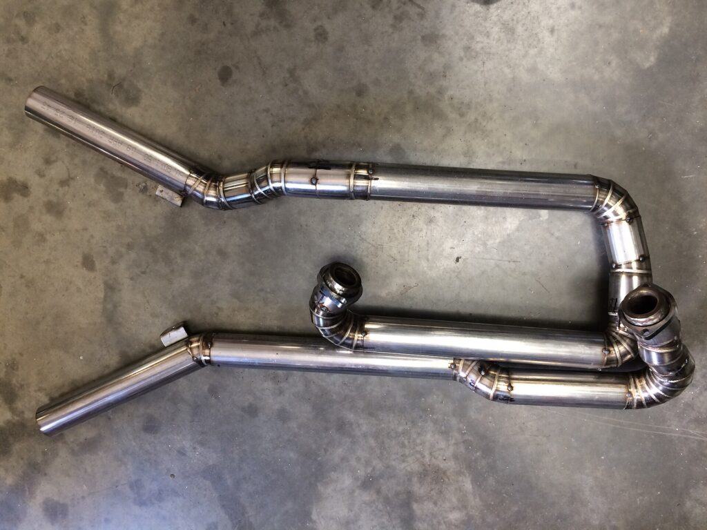 Bent stainless steel exhaust tubes joined with neat TIG weld beads