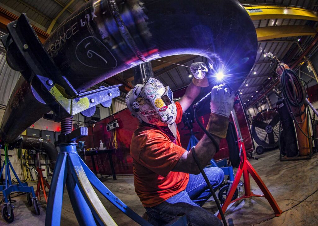Welder TIG welding a pipe